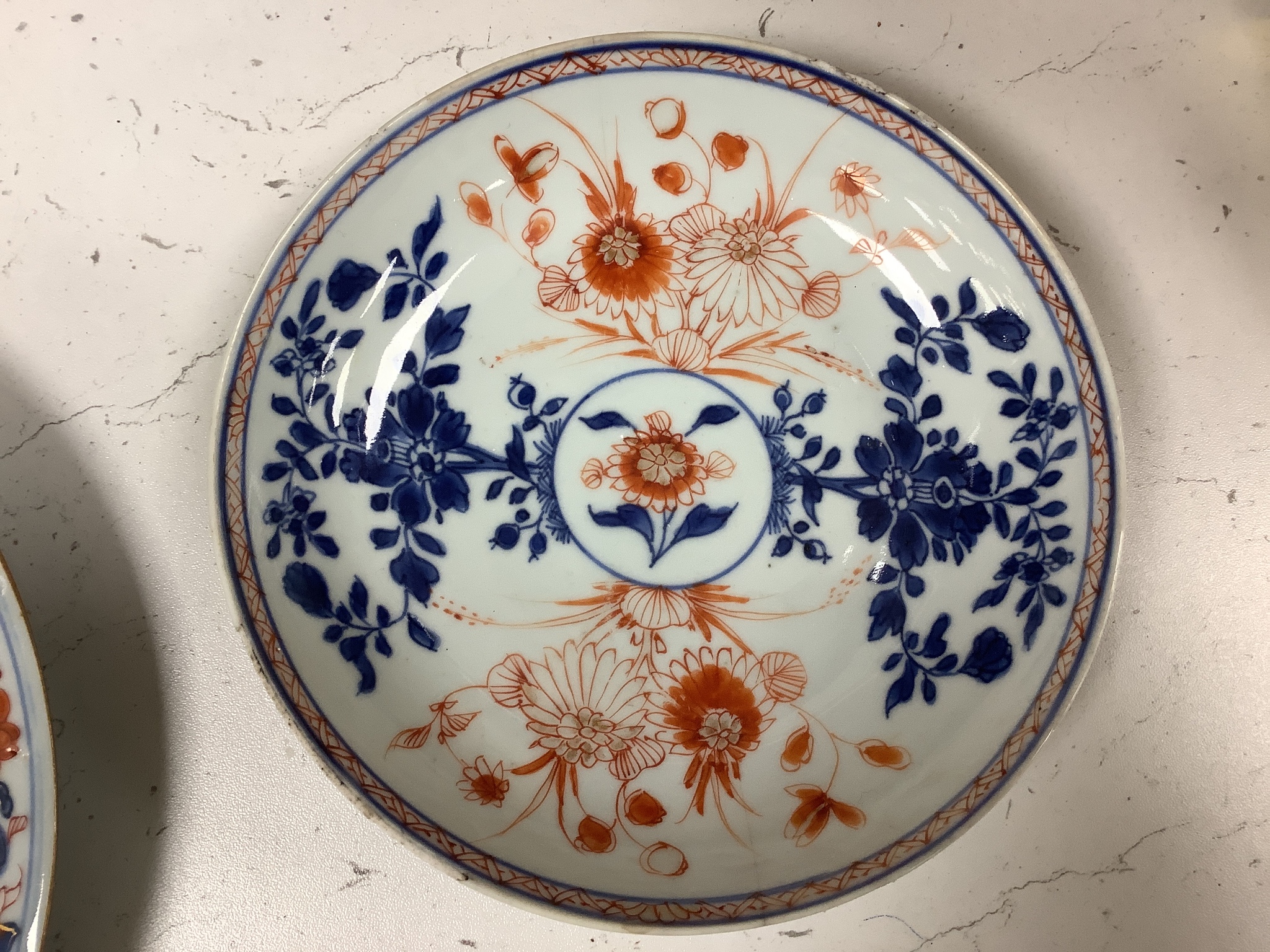 A pair of 18th century Chinese blue and white plates, together with two Chinese Imari dishes, all Kangxi period, largest 23cm